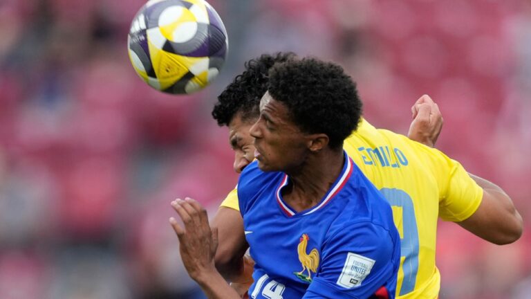 France's Noham Kamara and Colombia's Emilio Aristizabal go for a header during the FIFA U-20 World Cup third-place soccer match in Santiago, Chile, Saturday, Oct. 18, 2025. (Gustavo Garello/AP)