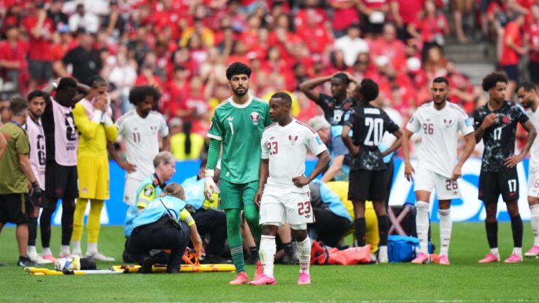 Qatar's Assim Madibo leaves the field after an injury to Canada's Ismael Kone during the match, in Vancouver on Thursday, June 18, 2026. (Darryl Dyck/CP)