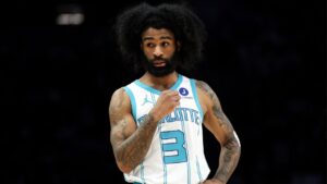 Charlotte Hornets guard Coby White (3) looks on during the first half of an NBA basketball game against the Minnesota Timberwolves, Sunday, April 5, 2026, in Minneapolis. (AP Photo/Matt Krohn)