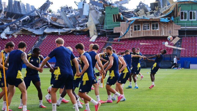 Demolition is visible to the stands at Toyota Stadium, home of MLS soccer's FC Dallas, as Sweden's Taha Ali, far right, tries to get to his head on the ball during a a training session ahead of Sweden's World Cup Group F soccer match against Japan, Wednesday, June 24, 2026, in Frisco, Texas. (AP Photo/Julio Cortez)