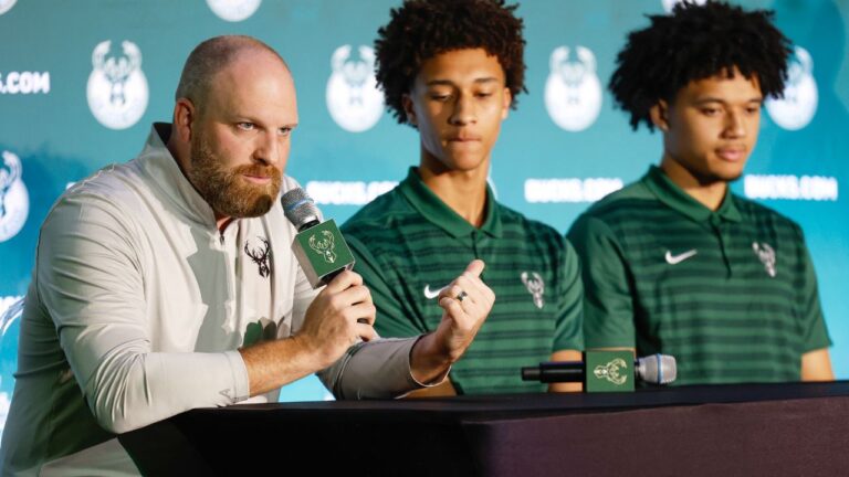 Milwaukee Bucks coach Taylor Jenkins speaks as first-round picks Nate Ament and Brayden Burries look on in Milwaukee on Thursday, June 25, 2026 (Jeffrey Phelps/AP)