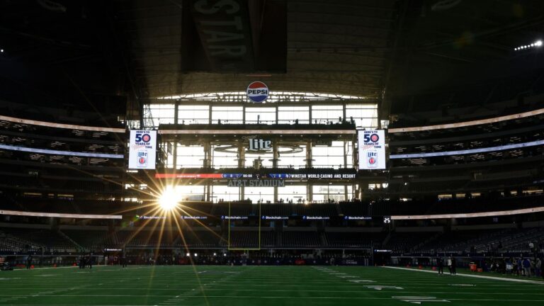 The sun sets through the windows at AT&T Stadium before a game between the Minnesota Vikings and the Dallas Cowboys on Sunday, Dec. 14, 2025, in Arlington, Texas. (Matt Patterson/AP)