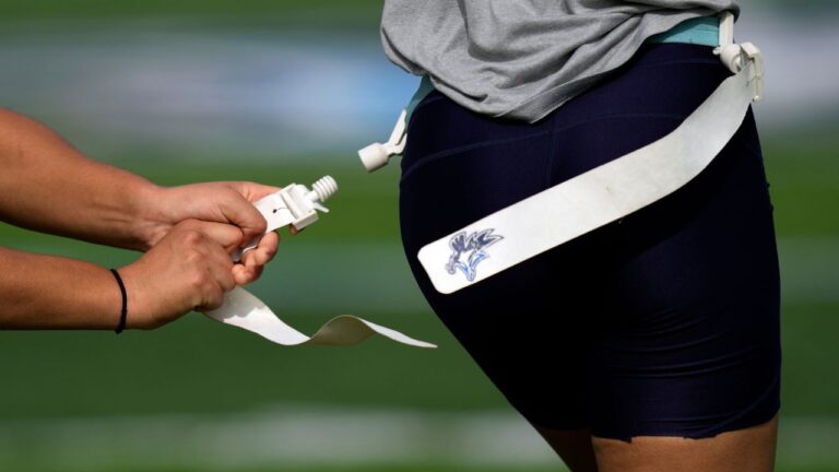 A defender pulls a flag at a training session for Keiser University's flag football team in West Palm Beach, Fla., on Nov. 30, 2023. (Rebecca Blackwell/AP)