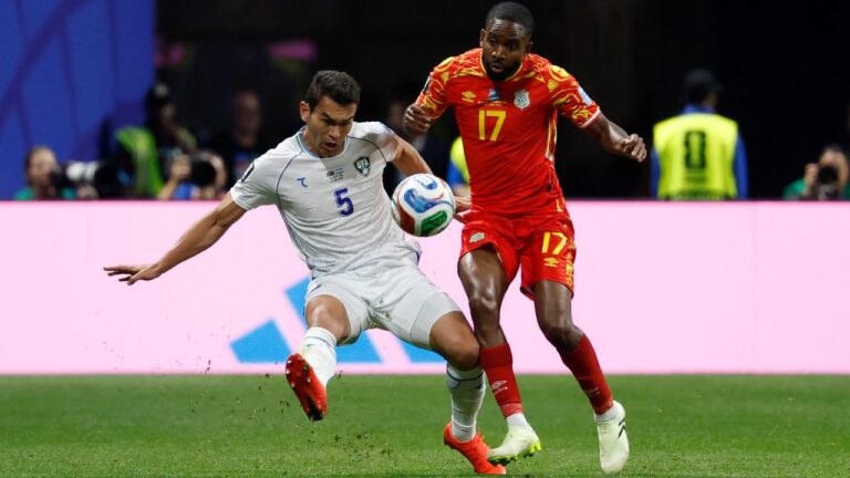 Uzbekistan's Rustam Ashurmatov (5) and Congo's Cedric Bakambu (17) battle for the ball during the World Cup Group K soccer match between DR Congo and Uzbekistan in Atlanta, Saturday, June 27, 2026. (Erik S.Lesser/AP)