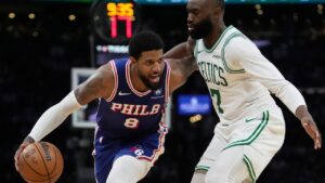 Paul George drives against Jaylen Brown during the second half in Game 1 of an NBA playoff series on Sunday, April 19, 2026, in Boston. (Robert F. Bukaty/AP)