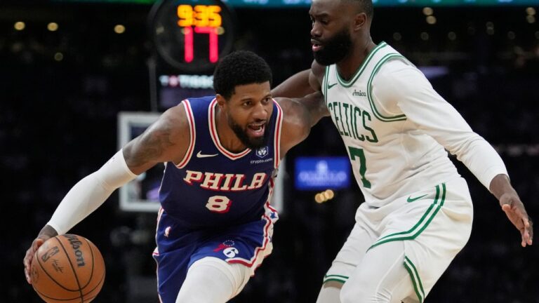 Paul George drives against Jaylen Brown during the second half in Game 1 of an NBA playoff series on Sunday, April 19, 2026, in Boston. (Robert F. Bukaty/AP)