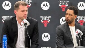 Chicago Bulls coach Tiago Splitter talks while Bryson Graham, the executive vice president of basketball operations, listens on Wednesday, June 17, 2026, in Chicago. (Jordan Cohen/AP)