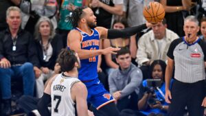 New York Knicks guard Jalen Brunson drives as San Antonio Spurs center Luke Kornet (7) defends during the second half of Game 5 of the NBA Finals basketball series, Saturday, June 13, 2026, in San Antonio. (AP Photo/Darren Abate)