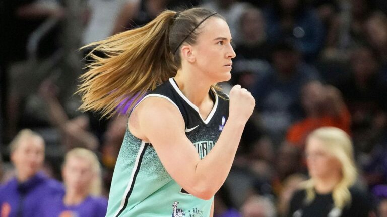 New York Liberty guard Sabrina Ionescu pumps her fist after her team's win over the Phoenix Mercury in overtime of Game 1 during the first round of the playoffs on Sunday, Sept. 14, 2025, in Phoenix. (Darryl Webb/AP)