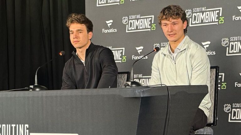 Defenceman Matthew Schaefer, right, and forward Michael Misa address reporters at the league's annual combine in Buffalo's downtown Harborcenter facility, Friday, June 6, 2025. (John Wawrow/AP)