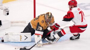 Vegas Golden Knights goaltender Carter Hart, left, stops a shot by Carolina Hurricanes left winger Taylor Hall during the first period in Game 4 of the Stanley Cup Final series Tuesday, June 9, 2026, in Las Vegas. (Candice Ward/AP)