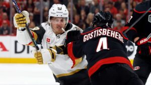 Vegas Golden Knights' Mitch Marner collides with Carolina Hurricanes' Shayne Gostisbehere during the first period in Game 5 of the Stanley Cup Final in Raleigh, N.C., Thursday, June 11, 2026. (Karl DeBlaker/AP)