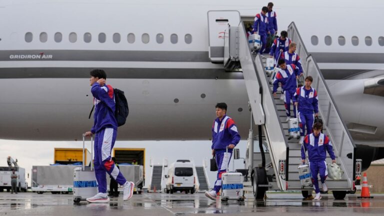 Members of the Japan national team walk off a plane after arriving for the World Cup on Monday, June 8, 2026, in Nashville, Tenn. (George Walker IV/AP)