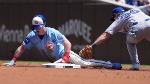 Chicago Cubs' Pete Crow-Armstrong, left steals second base as Toronto Blue Jays' Davis Schneider, right, during the first inning of a game Friday, June 19, 2026, in Chicago. (David Banks/AP)