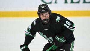 North Dakota defenseman Keaton Verhoeff skates to the puck against St. Cloud State during an NCAA hockey game on Saturday, Dec. 6, 2025 in St. Cloud, Minn. (AP Photo/Craig Lassig)