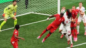 Switzerland's Breel Embolo (7), Canada's Jonathan David (10) and Switzerland's Manuel Akanji (5) battle for the a. header during the World Cup Group B soccer match between Switzerland and Canada in Vancouver, Wednesday, June 24, 2026. (Kaleb Tatum/AP)