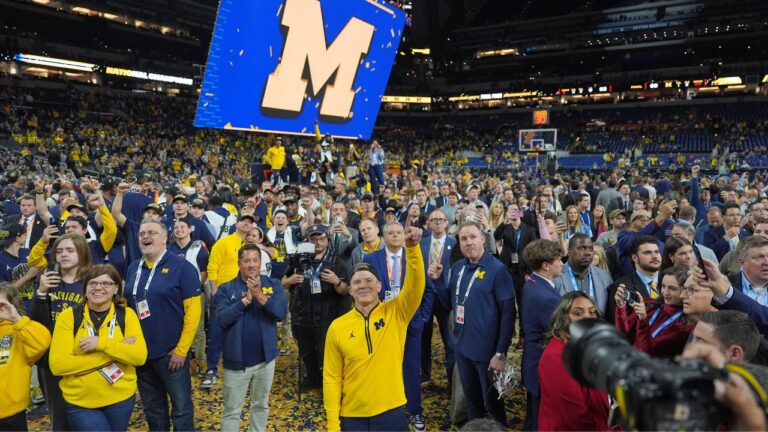 Michigan head coach Dusty May celebrates after defeating UConn in the NCAA college basketball tournament national championship game on April 7, 2026, in Indianapolis. (Michael Conroy/AP)