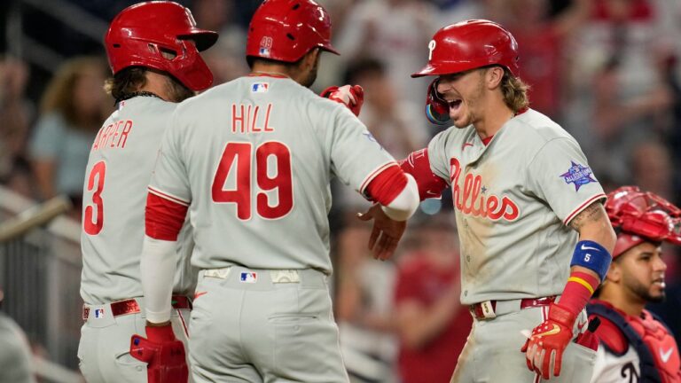 Bryson Stott, right, celebrates his three-run home run with Bryce Harper and Derek Hill during the ninth inning against the Nationals on Tuesday, June 23, 2026, in Washington. (Jess Rapfogel/AP)