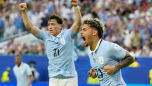 Uruguay's Maxi Araujo celebrates scoring his side's opening goal against Saudi Arabia during a World Cup Group H soccer match in Miami Gardens, Fla., Monday, June 15, 2026. (AP Photo/Lynne Sladky)