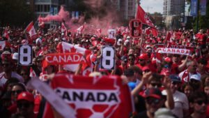 Canada fans march to B.C. Place stadium before Canada and Switzerland play a World Cup Group B soccer match, in Vancouver, on Wednesday, June 24, 2026. (Darryl Dyck/CP)
