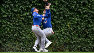 Toronto Blue Jays right fielder Myles Straw, left, and centre fielder Dulton Varsho collide as Varsho' makes the catch on a fly ball hit by Chicago Cubs' Miguel Amaya during the fourth inning of a baseball game, Saturday, June 20, 2026, in Chicago. (Matt Marton/AP)