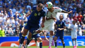 Qatar's Edmilson Junior (8), right, and Bosnia's Nikola Katic (18) jump for the ball during the World Cup Group B soccer match between Bosnia and Qatar in Seattle Wednesday, June 24, 2026. (Manu Fernandez/AP Photo)