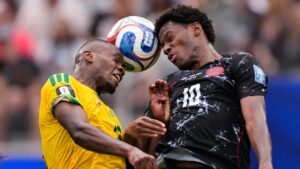 South Africa's Sphephelo Sithole and Canada's Jonathan David (10) go for a header during a World Cup round of 32 soccer match in Inglewood, Calif., near Los Angeles, Sunday, June 28, 2026. (Mark J. Terrill/AP)