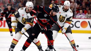 Carolina Hurricanes' Andrei Svechnikov (37) battles for the puck between Vegas Golden Knights' Brayden McNabb (3) and Tomas Hertl (48) during the second period in Game 1 of the NHL hockey Stanley Cup Final series in Raleigh, N.C., Tuesday, June 2, 2026. (Karl DeBlaker/AP)