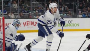 Toronto Maple Leafs defenceman Brandon Carlo (25) clears the puck as goaltender Anthony Stolarz (41) looks on against Seattle Kraken centre Chandler Stephenson, right, during the first period of an NHL hockey game Thursday, Jan. 29, 2026, in Seattle. (Lindsey Wasson/AP)