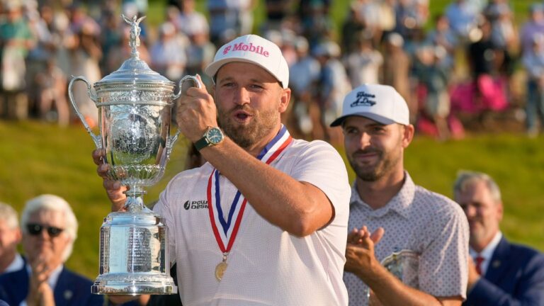 Wyndham Clark holds the trophy after winning the U.S. Open golf tournament at Shinnecock Hills Golf Club in Southampton, N.Y., Sunday, June 21, 2026. (David J. Phillip/AP Photo)