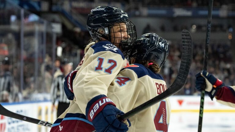 Montreal Victoire's Dara Greig (17) and Amanda Boulier (44) celebrate Greig's goal against the Vancouver Goldeneyes during the second period of a PWHL hockey game in Vancouver, B.C., Saturday, Dec. 20, 2025. (Ethan Cairns/CP)
