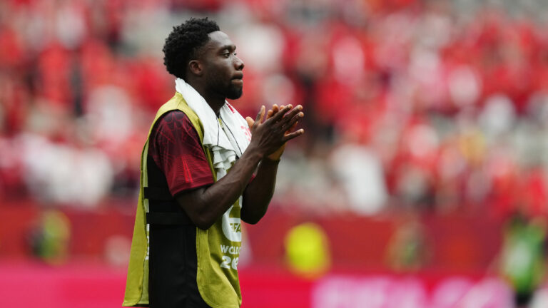 Canada's Alphonso Davies (19) acknowledges the crowd after his team lost to Switzerland in a World Cup Group B soccer match, in Vancouver, on Wednesday, June 24, 2026. (Ethan Cairns/CP)