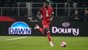 Canada defenseman Alphonso Davies controls the ball during an international friendly soccer match against Mexico.(Tony Gutierrez/AP)