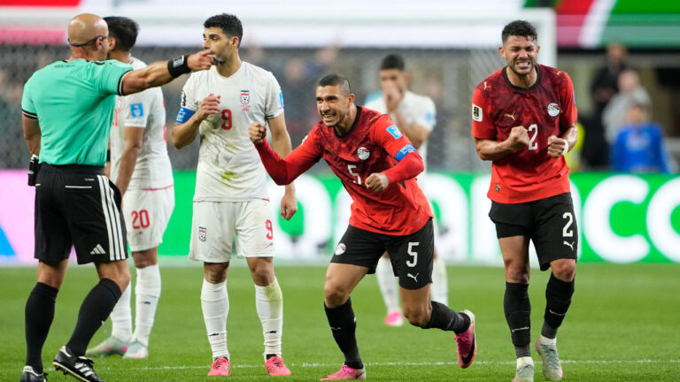 Egypt's Ramy Rabia (5) and Egypt's Yasser Ibrahim (2) celebrate after Iran's Shoja Khalilzadeh's goal was overturned following a VAR review during the World Cup Group G soccer match between Egypt and Iran in Seattle, Friday, June 26, 2026. (Lindsey Wasson/AP)