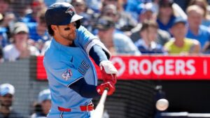 Toronto Blue Jays' Ernie Clement (22) hits a three run home run during third inning MLB baseball action against the Baltimore Orioles, in Toronto, Saturday, June 6, 2026. (Frank Gunn/CP)