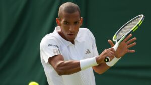 Felix Auger-Aliassime of Canada returns the ball to Alexander Shevchenko of Kazakhstan during the men's singles match at the Wimbledon Tennis Championships in London, Monday, June 29, 2026.(Kirsty Wigglesworth/AP Photo)