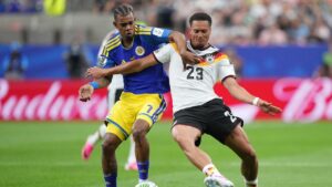 Curacao's Juninho Bacuna, left, and Germany's Felix Nmecha fight for the ball during the World Cup Group E soccer match between Germany and Curacao in Houston, Sunday, June 14, 2026. (Eric Gay/AP)