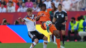 Germany's Joshua Kimmich, left, vires for the ball with Ivory Coast's Joshua Kimmich, during the World Cup Group E soccer match between Germany and Ivory Coast in Toronto, Saturday, June 20, 2026. (Stephanie Scarbrough/AP Photo)