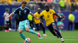 Germany's Joshua Kimmich (6) plays the ball as Ecuador's Enner Valencia (13) chases during the World Cup Group E soccer match between Ecuador and Germany in East Rutherford, N.J., near New York, Friday, June 26, 2026. (Steve Luciano/AP)
