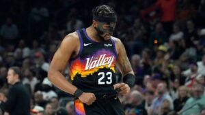 Phoenix Suns guard Jordan Goodwin celebrates his three-pointer against the Dallas Mavericks during the first half of an NBA basketball game, Wednesday, April 8, 2026, in Phoenix. (Ross D. Franklin/AP)