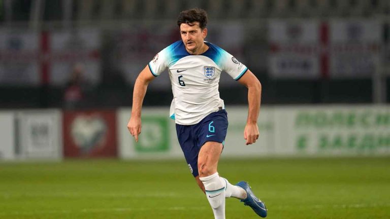 England's Harry Maguire runs with the ball during the Euro 2024 group C qualifying soccer match. (Darko Vojinovic/AP)