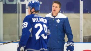 Toronto Maple Leafs assistant coach Jim Hiller, right, speaks with William Nylander during training camp in Halifax on Saturday, September 24, 2016. (Darren Calabrese/CP)
