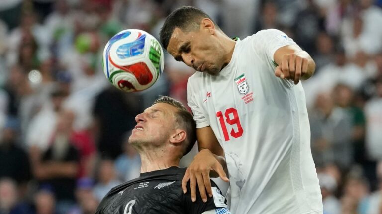 Iran's Ali Nemati (19) battles for the ball with New Zealand's Chris Wood (9) during the World Cup Group G soccer match between Iran and New Zealand in Inglewood, Calif., near Los Angeles, Monday, June 15, 2026. (Andre Penner/AP Photo)