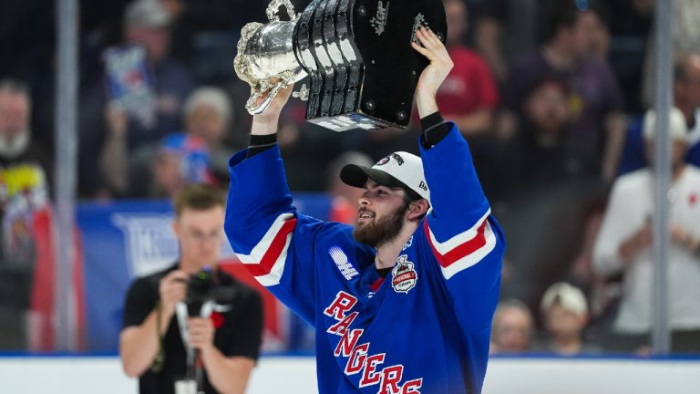 Kitchener Rangers' Jack Pridham hoists the Memorial Cup after Kitchener defeated the Everett Silvertips to win the Memorial Cup final hockey game, in Kelowna, B.C., on Sunday, May 31, 2026. (Darryl Dyck/CP)