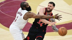 Toronto Raptors forward Sandro Mamukelashvili passes against Cleveland Cavaliers guard James Harden during the first half in Game 5 of a first-round NBA playoffs basketball series, Wednesday, April 29, 2026, In Cleveland. (David Dermer/AP)