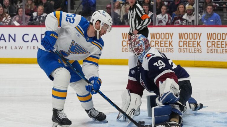 Colorado Avalanche goaltender MacKenzie Blackwood, right, stops a shot by St. Louis Blues left wing Jonathan Drouin in the second period of an NHL hockey game Sunday, April 5, 2026, in Denver. (David Zalubowski/AP)
