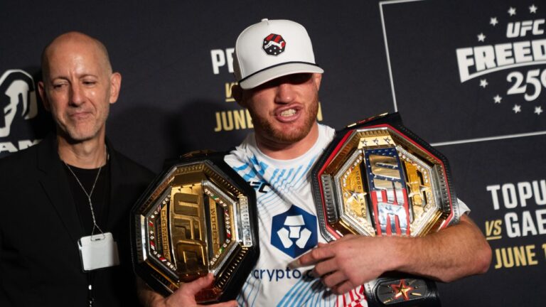 Justin Gaethje holds his championship belts at a press conference following the UFC Freedom 250 fight, Monday, June 15, 2026, in Washington. (Allison Robbert/AP)