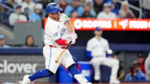 Toronto Blue Jays catcher Alejandro Kirk (30) hits an equalizer solo home run during ninth inning MLB baseball action against the Athletics, in Toronto on Saturday, March 28, 2026. (Frank Gunn/CP)