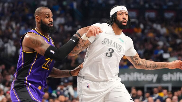 Los Angeles Lakers' LeBron James, left, works against Dallas Mavericks' Anthony Davis (3) in the first half of an NBA basketball game in Dallas, Wednesday, April 9, 2025. (LM Otero/AP)