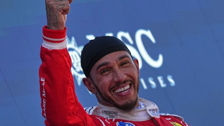 Ferrari driver Lewis Hamilton of Britain gestures at the podium after winning the Spain F1 Grand Prix race at the Barcelona Catalunya racetrack in Montmelo, near Barcelona, Spain, Sunday, June 14, 2026. (Fatima Shbair/AP)